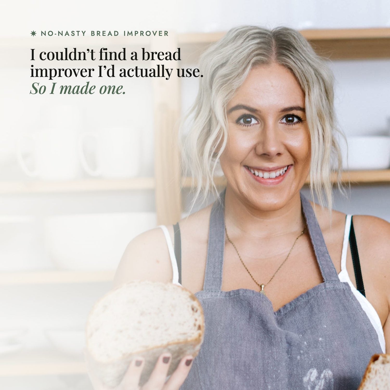 Alyce Alexandra in a grey apron in her kitchen holding a halved sourdough loaf of bread, with overlay text reading No-Nasty Bread Improver, I couldn't find a bread improver I'd actually use, so I made one