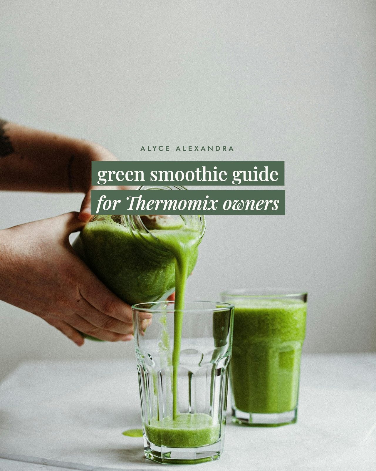 Hands pouring a bright green smoothie from a jug into a tall glass, with a second full glass alongside; the green smoothie guide for Thermomix owners