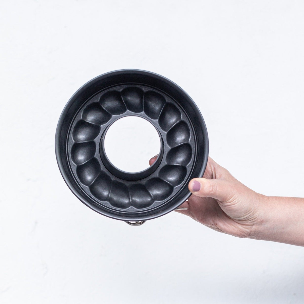 2-in-1 Springform Pan held flat to show the scalloped ring pattern that shapes the cake