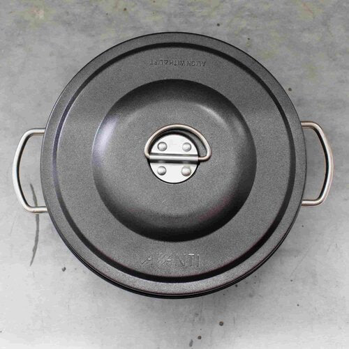 2L non-stick steamer seen from above showing the lid clip and the two side handles