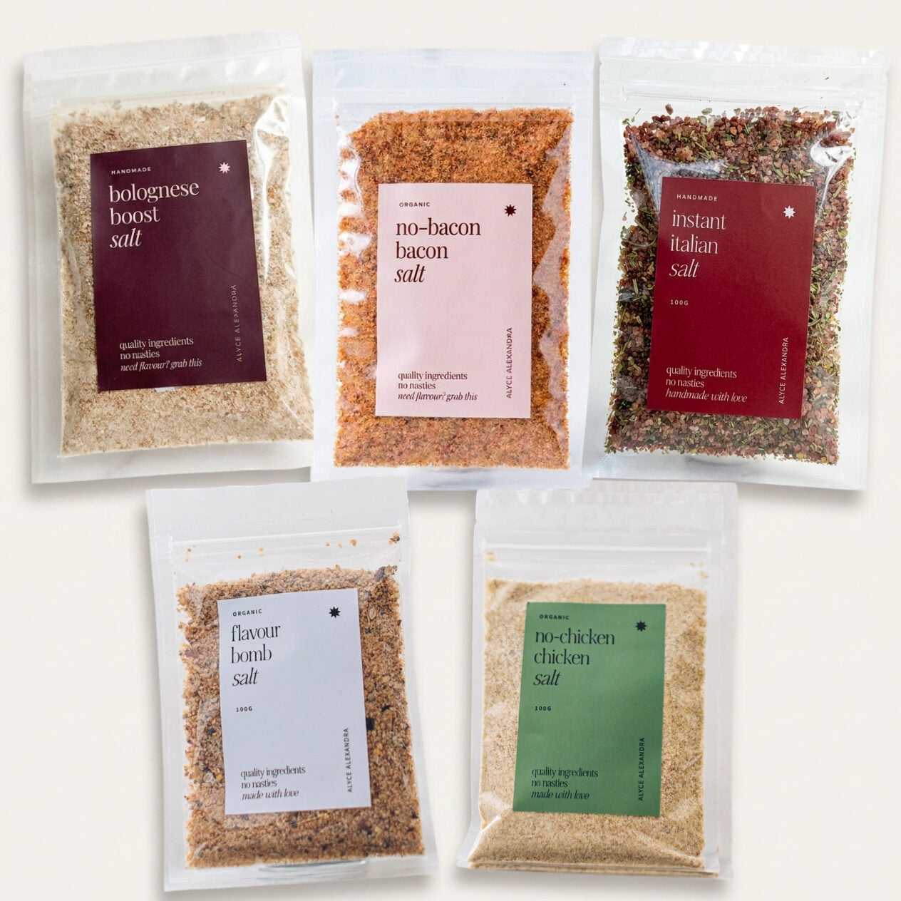 All five Alyce's Flavour Bombs Starter Pack salt packets on a cream background: Bolognese Boost, No-Bacon Bacon, Instant Italian, Flavour Bomb and No-Chicken Chicken; every blend in one box