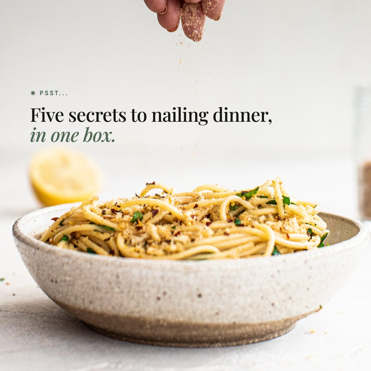 Hand sprinkling seasoning salt over a bowl of spaghetti with lemon; Alyce's Flavour Bombs Starter Pack teaser: psst, five secrets to nailing dinner, in one box