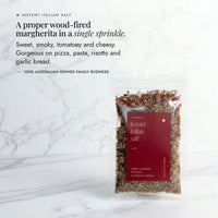 Instant Italian Salt packet on a marble bench; a proper wood-fired margherita in a single sprinkle, sweet, smoky, tomatoey and cheesy, gorgeous on pizza, pasta, risotto and garlic bread, from a 100% Australian owned family business