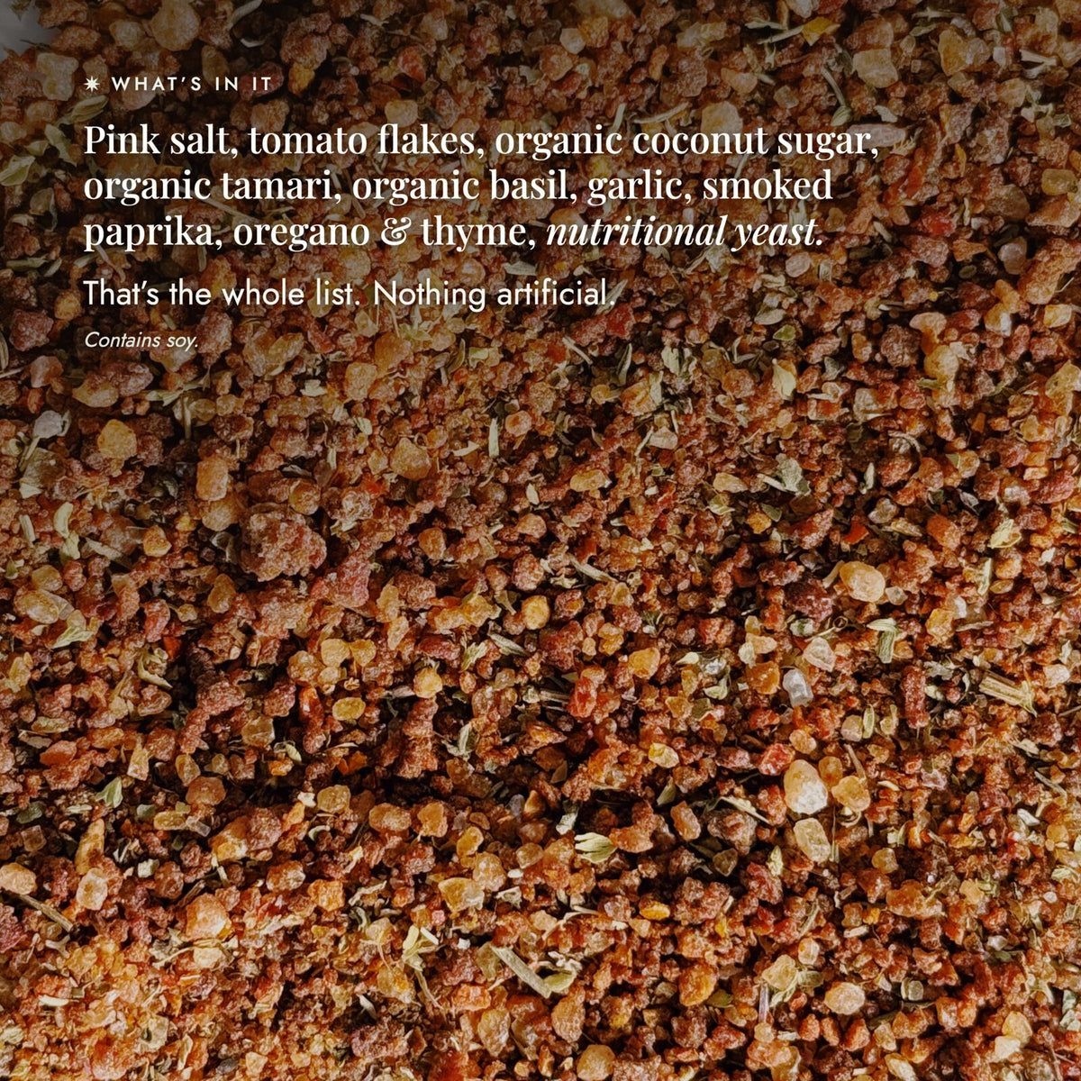 Close-up of the Instant Italian Salt blend showing the whole ingredient list: pink salt, tomato flakes, organic coconut sugar, organic tamari, organic basil, garlic, smoked paprika, oregano and thyme, and nutritional yeast; that is the whole list, nothing artificial