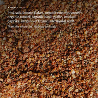Close-up of the Instant Italian Salt blend showing the whole ingredient list: pink salt, tomato flakes, organic coconut sugar, organic tamari, organic basil, garlic, smoked paprika, oregano and thyme, and nutritional yeast; that is the whole list, nothing artificial
