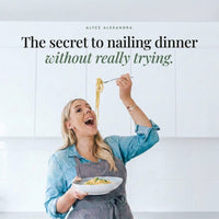 Alyce laughing as she lifts a forkful of spaghetti above her bowl; Organic Flavour Bomb Salt is the secret to nailing dinner without really trying