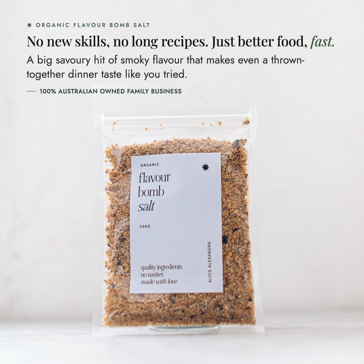 Organic Flavour Bomb Salt packet on a pale bench; no new skills and no long recipes, just better food fast, a big savoury hit of smoky flavour that makes even a thrown-together dinner taste like you tried, from a 100% Australian owned family business