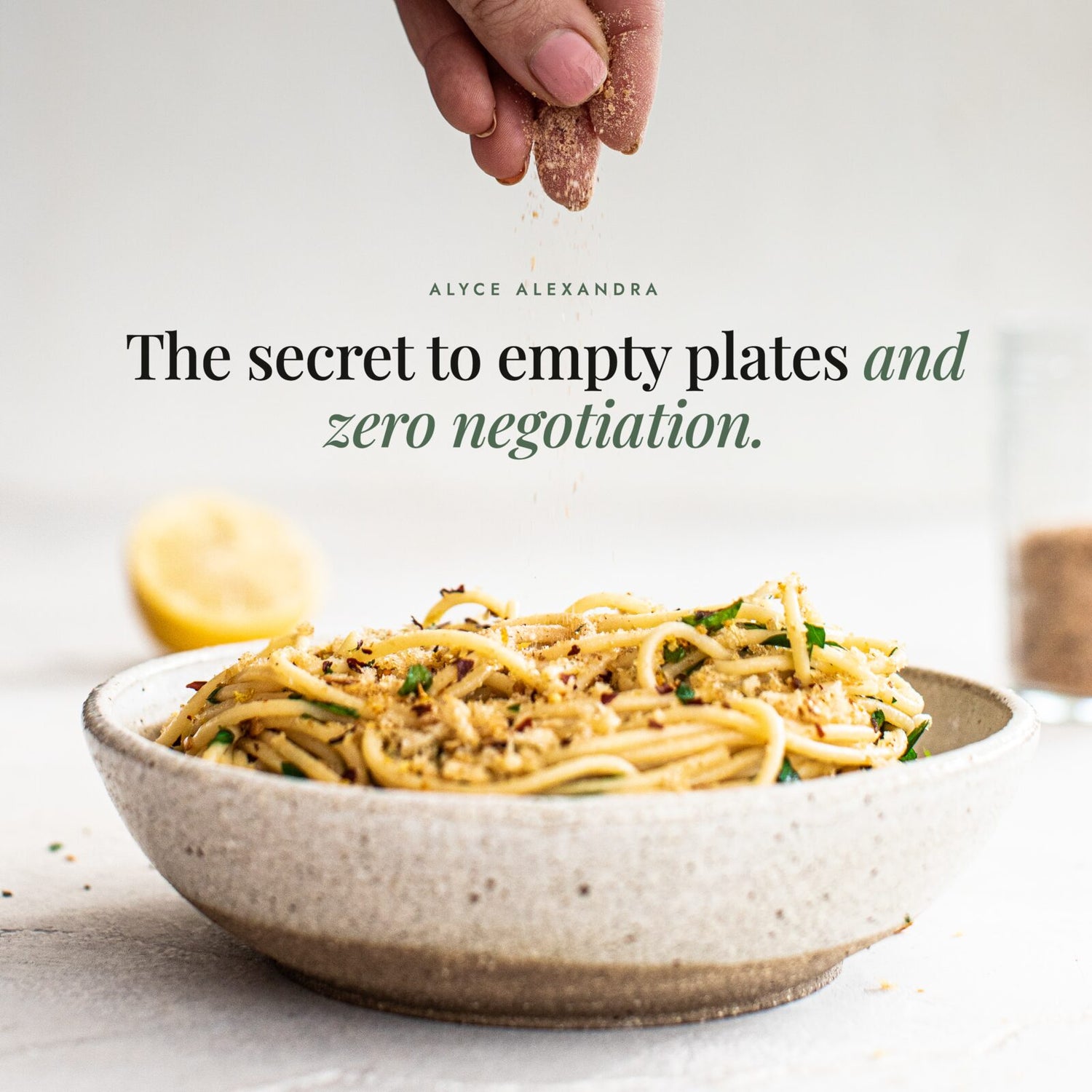 Hand sprinkling Organic No-Chicken Chicken Salt over a bowl of spaghetti; the secret to empty plates and zero negotiation