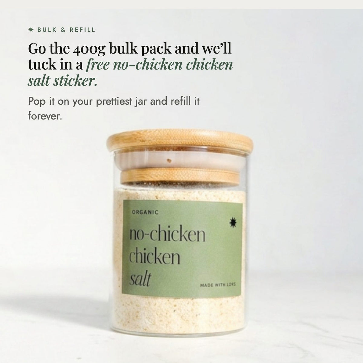 Glass jar of No-Chicken Chicken Salt with a bamboo lid; go the 400g bulk pack and a free No-Chicken Chicken Salt sticker is tucked in, so you can pop it on your prettiest jar and refill it forever