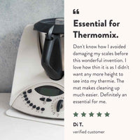 Five-star customer review of the Appliance Mat from Di T, who says it stopped her damaging her scales, adds almost no height so she can still see into the bowl, and makes cleaning up much easier