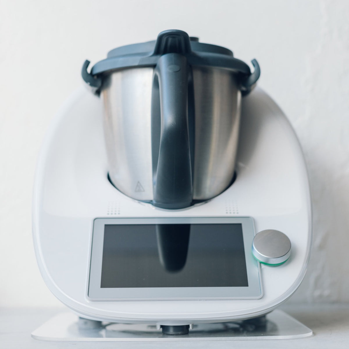 Thermomix resting on the Appliance Mat, viewed straight on from the front of the benchtop