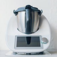 Thermomix resting on the Appliance Mat, viewed straight on from the front of the benchtop