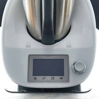 Close-up of the front of a Thermomix TM6 with its touchscreen and dial, sitting on the Appliance Mat