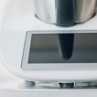 Thermomix base and touchscreen with a white Appliance Mat underneath, seen close up from the front