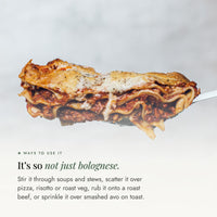 Cheesy slice of lasagne lifted on a serving spoon; Bolognese Boost Salt is not just for bolognese, stir it through soups and stews, scatter over pizza, risotto or roast veg, or sprinkle on smashed avo toast