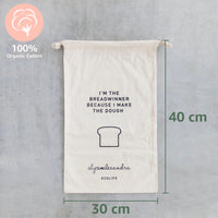 Breadwinner Bread Bag shown with its measurements, 40 cm tall by 30 cm wide, and a 100% organic cotton badge