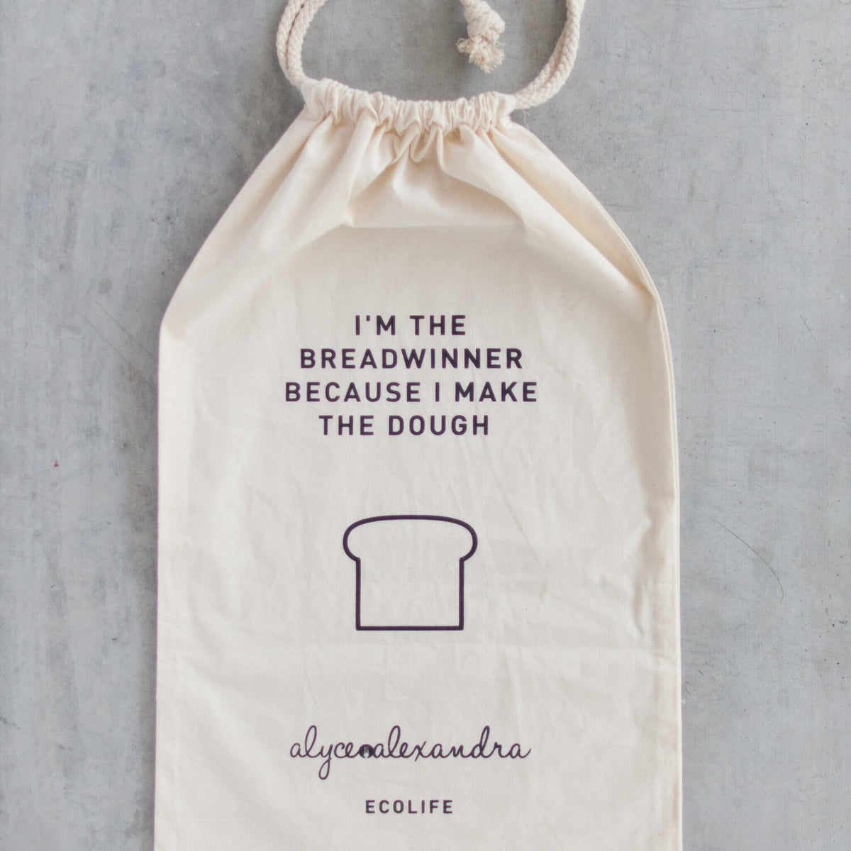 Breadwinner Bread Bag laid flat showing the full print and the alyce alexandra ecolife logo along the bottom