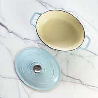 Chasseur cast iron oval Dutch oven with the lid off, showing the cream enamel interior