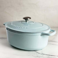 Duck egg blue Chasseur cast iron oval Dutch oven shown from the side