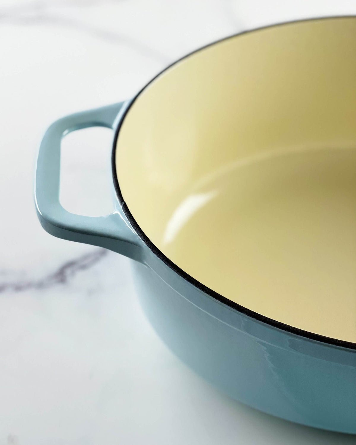 Chasseur cast iron oval Dutch oven from above, showing the cream enamel cooking surface