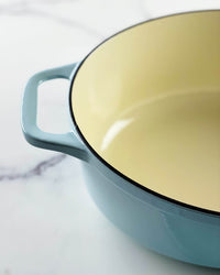 Chasseur cast iron oval Dutch oven from above, showing the cream enamel cooking surface