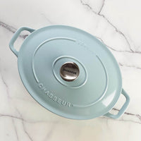Duck egg blue Chasseur cast iron oval Dutch oven with the lid on, seen from above