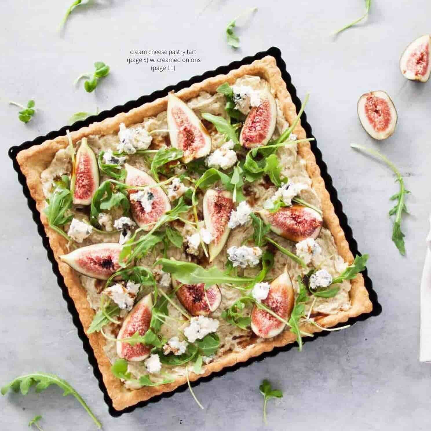 Square cream cheese pastry tart topped with figs, rocket and goat's cheese, made with the creamed onions recipe from the Champagne Breakfast Class Booklet