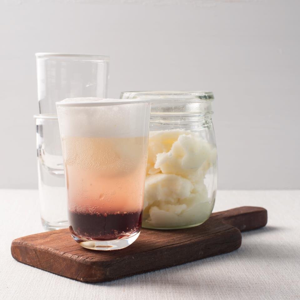 Layered berry and cream drink in a tall glass beside a jar of sorbet on a wooden board, from the Champagne Breakfast Class Booklet