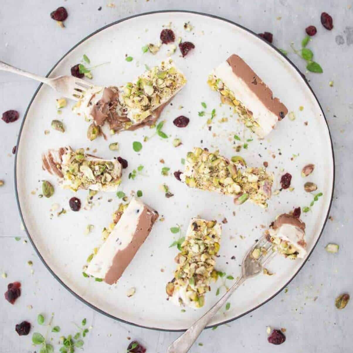 Platter of sliced meat topped with a herb and pistachio crust, from the Christmas Class Booklet for Thermomix machines