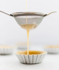 Latte squares scattered on a white surface with coffee beans, from the Class Booklet Bundle