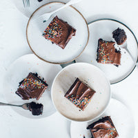 Chocolate slice squares served on plates with forks, baked in the Deep Sheet Pan