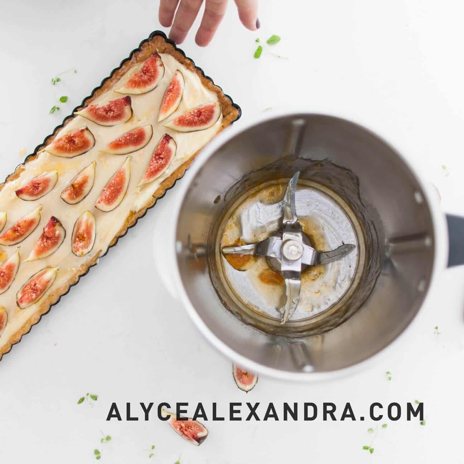 Long fig tart with frangipane filling beside a Thermomix mixing bowl, from the Desserts Class Booklet