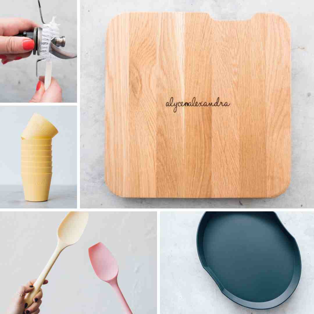 Everything in the Essentials Bundle for Thermomix owners: the wooden slide board, the yellow stackable cups, the silicone spatulas and the steaming mat
