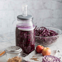 Kilner Fermentation Set jar filled with red cabbage, with the airlock lid fitted