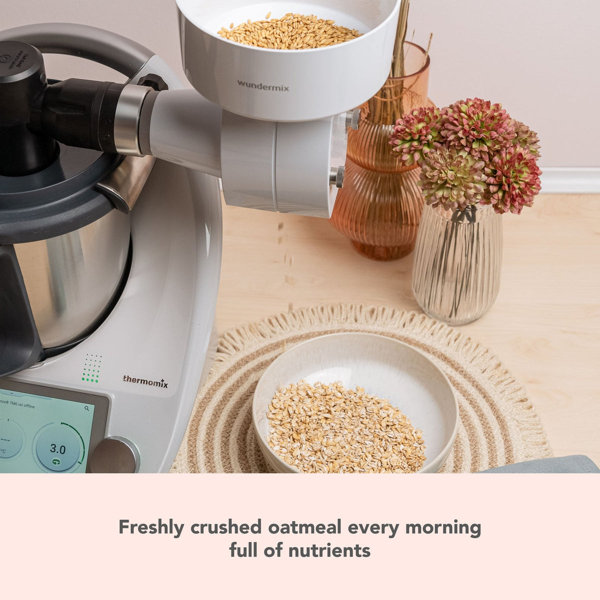 Grain Flaker on a Thermomix beside a bowl of oats; freshly crushed oatmeal every morning, full of nutrients