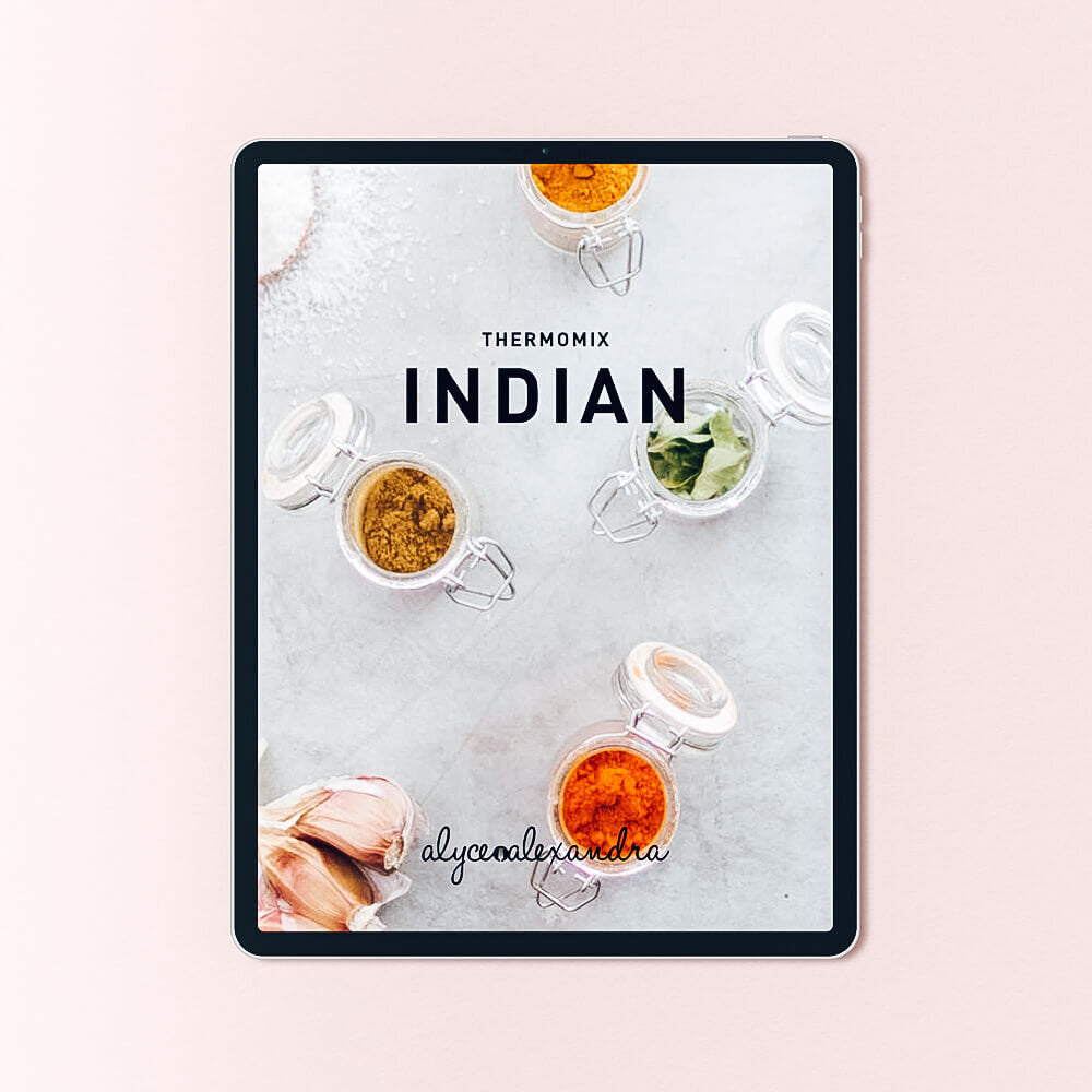 Indian Class Booklet for Thermomix machines shown on a tablet, the cover styled with curries and naan