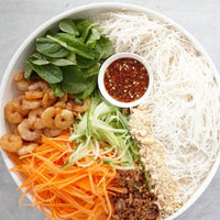 Noodle salad bowl with julienned carrot, prawns, herbs and chilli dressing, prepped with the Julienne Peeler