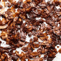 Tray of crispy smoked coconut bacon made with Liquid Smoke