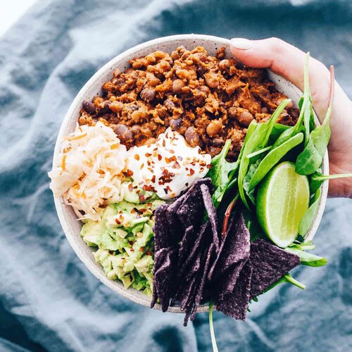 Bowl of smoky mince with avocado, lime and greens, seasoned with Liquid Smoke