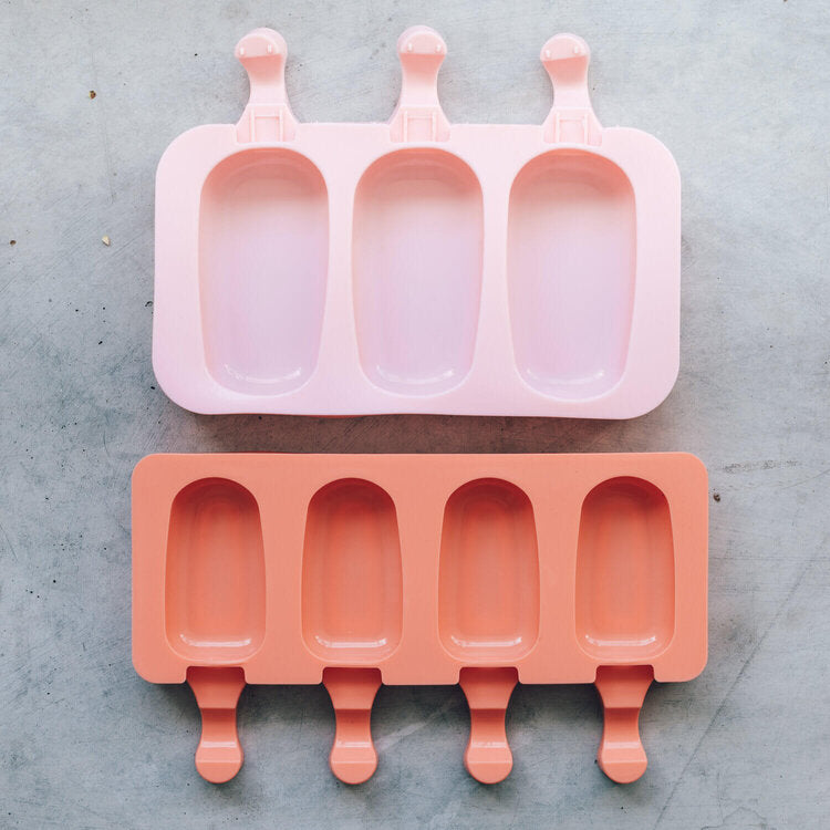 Pink and terracotta Mini Silicone Ice Cream Mould trays stacked together