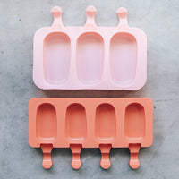 Pink and terracotta Mini Silicone Ice Cream Mould trays stacked together