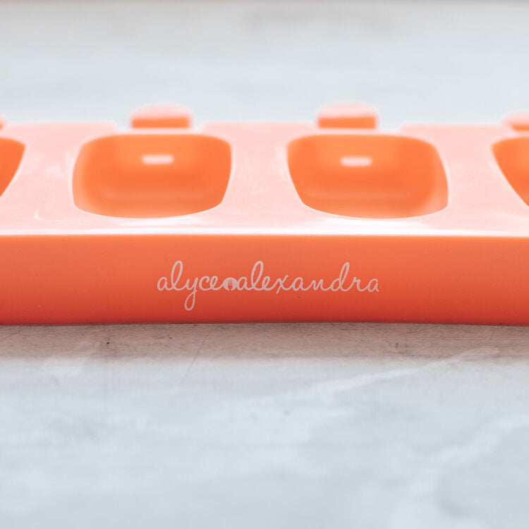 Close-up of the terracotta Mini Silicone Ice Cream Mould tray with the alyce alexandra name embossed on the side
