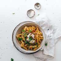 Bowl of slow cooked pasta with herbs and cream, from Modern Slow Cooker