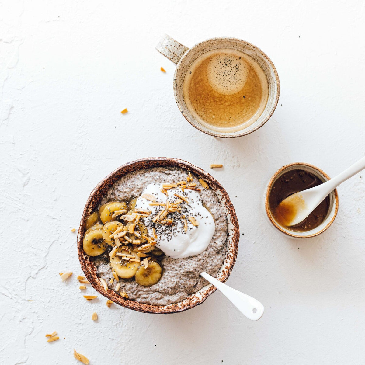 Bowl of slow cooked rice pudding with banana and honey, from Modern Slow Cooker