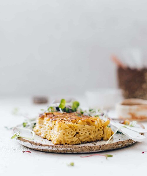 Golden slow cooked cake on a plate with cream, from Modern Slow Cooker