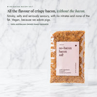 No-Bacon Bacon Salt packet on a marble bench; all the flavour of crispy bacon without the bacon, smoky, salty and seriously savoury with no nitrates and none of the fat, vegan because we adore pigs, from a 100% Australian owned family business