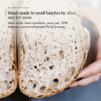 Hands holding a large sourdough loaf cut in half to show its crumb; No-Nasty Bread Improver is hand-made in small batches by Alyce and her mum