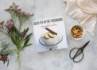Quick Fix in the Thermomix beside a bowl of granola, dried flowers and scissors on a pale bench
