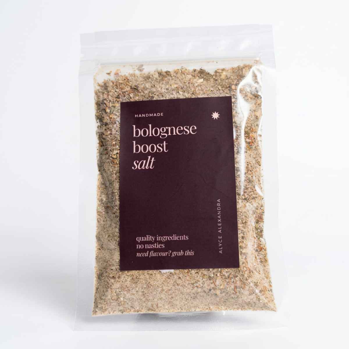 Alyce's Bolognese Boost Salt 100g bag with deep red label, the golden savoury seasoning blend visible through the clear packet