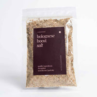 Alyce's Bolognese Boost Salt 100g bag with deep red label, the golden savoury seasoning blend visible through the clear packet